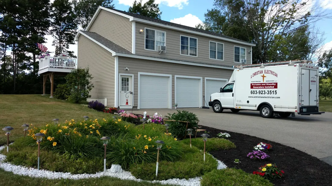A Christian Electrician's lettered box truck parked at a customer's home